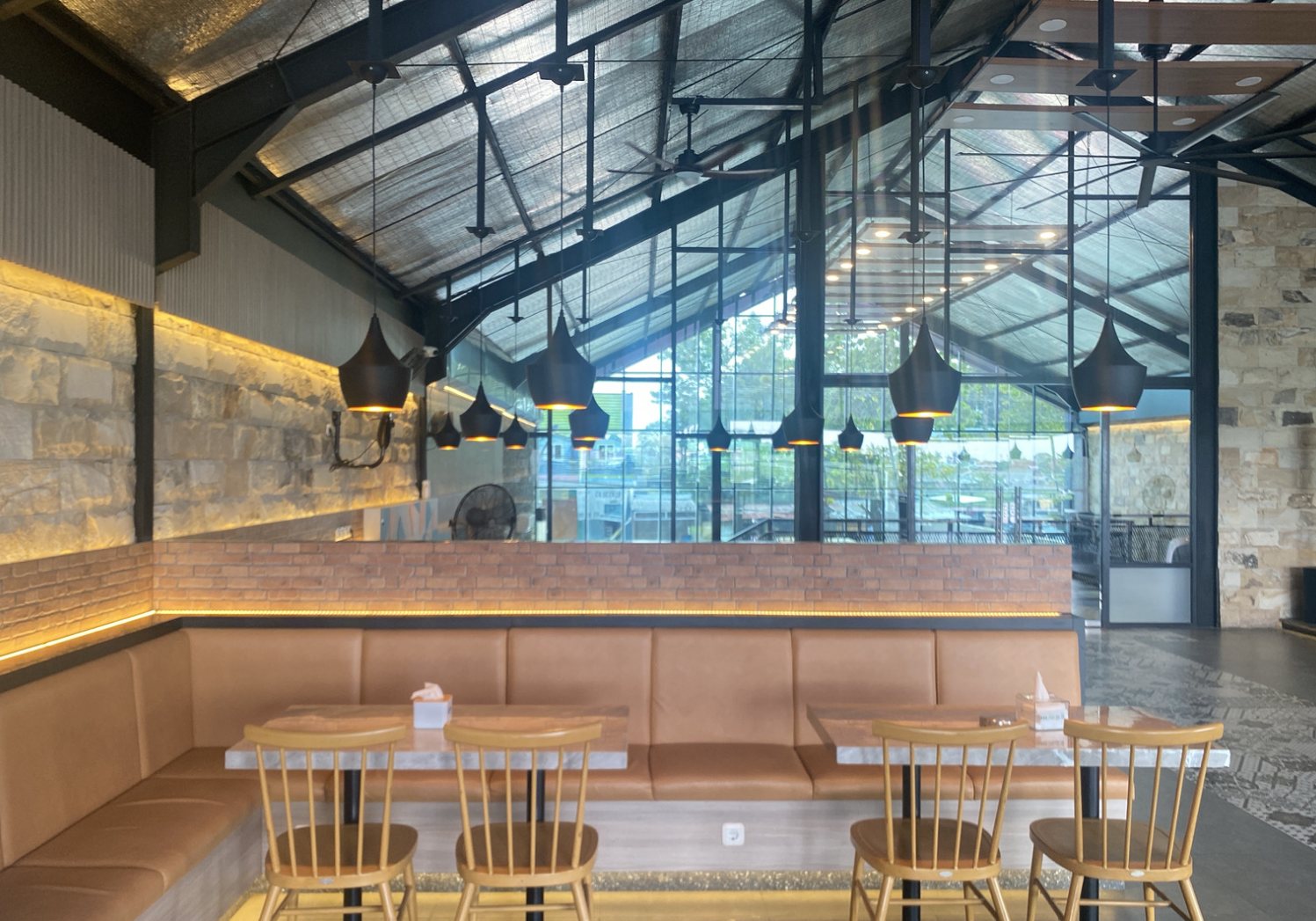 Booth seating reference: industrial style with leather bench seating